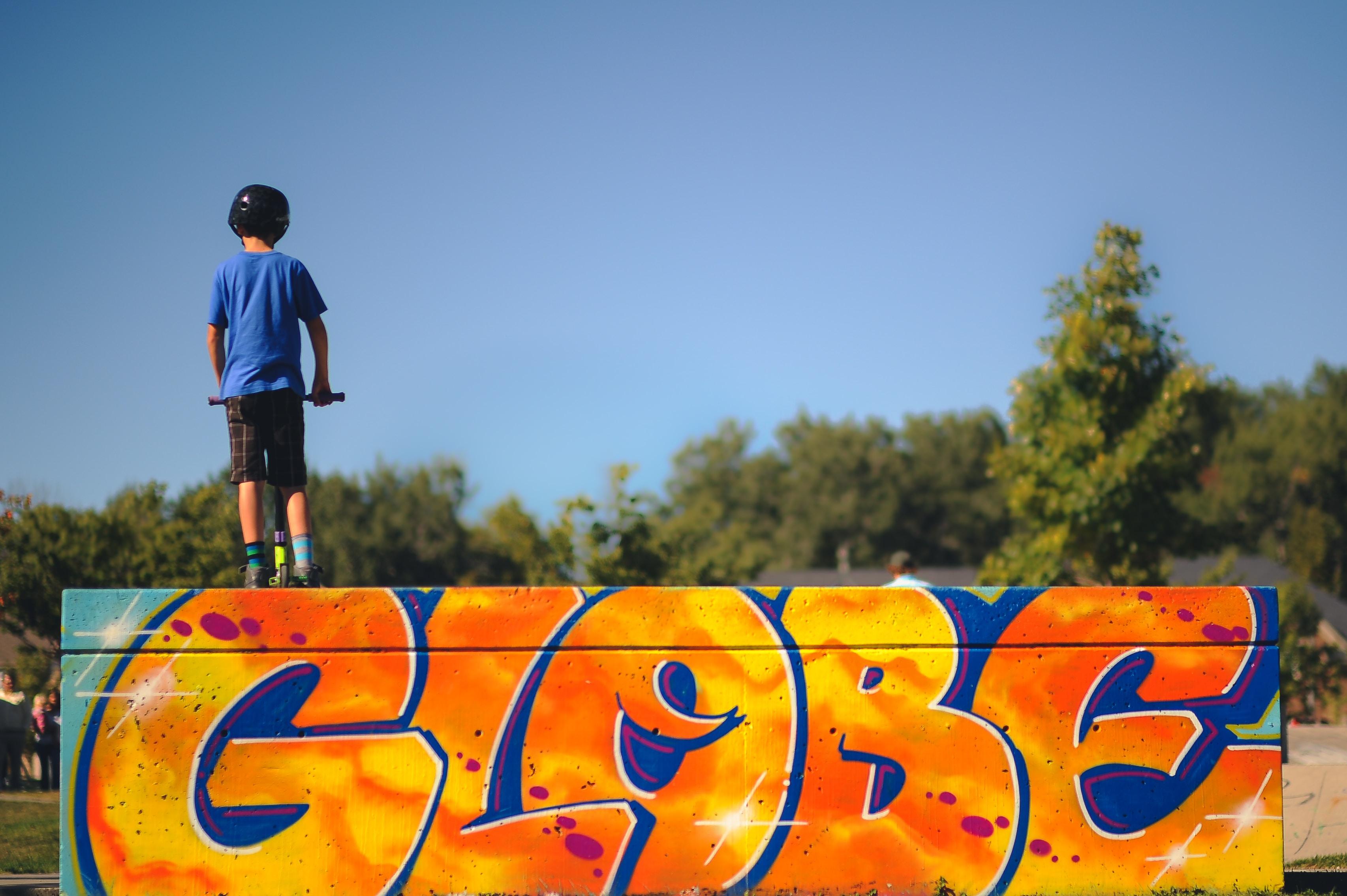 child deciding if they should go down skate ramp