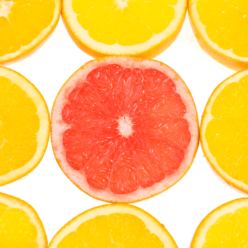 three rows lemon slices with one orange slice in the center 